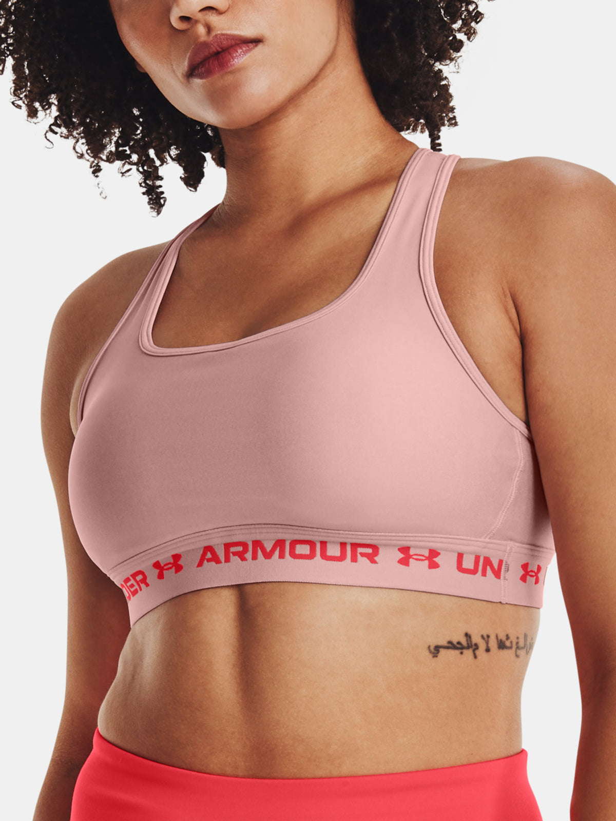 Nõi melltartó Under Armour UA Crossback Mid Hthr rózsaszín sportmelltartó