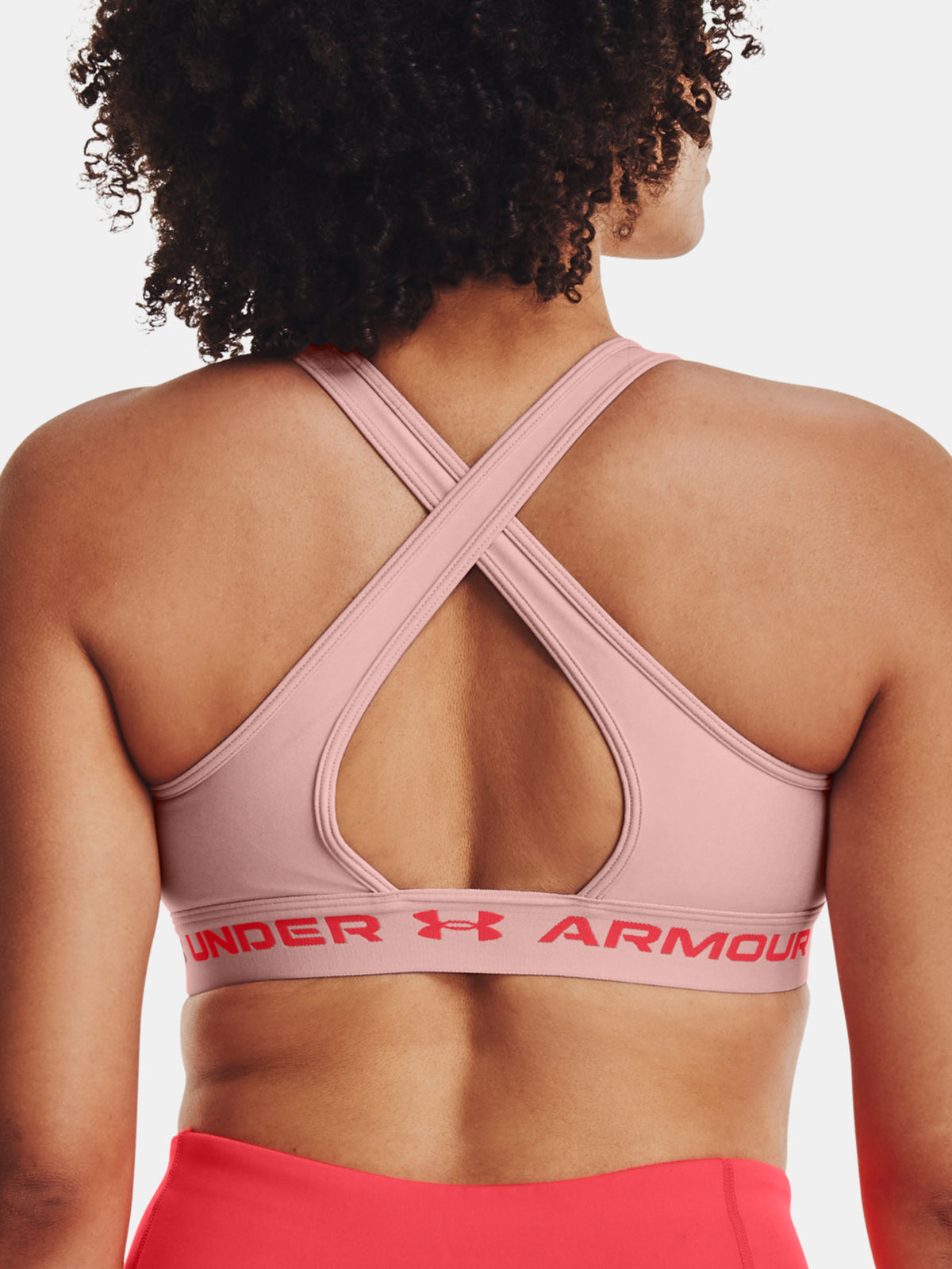 Nõi melltartó Under Armour UA Crossback Mid Hthr rózsaszín sportmelltartó